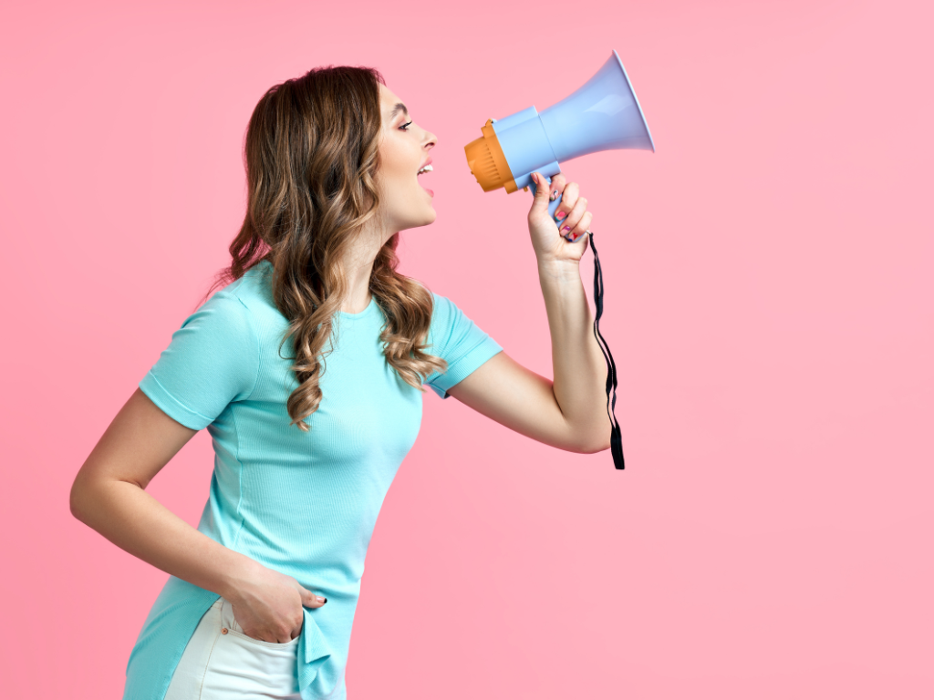 girl with megaphone promoting silent auction