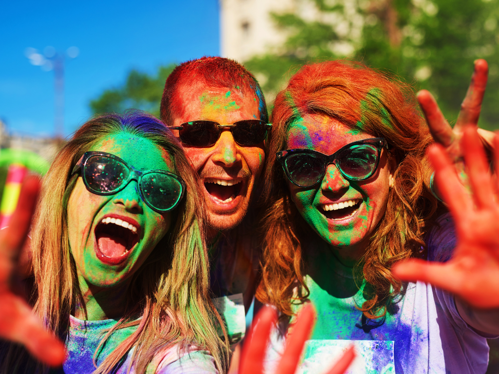 group of people celebrating color run