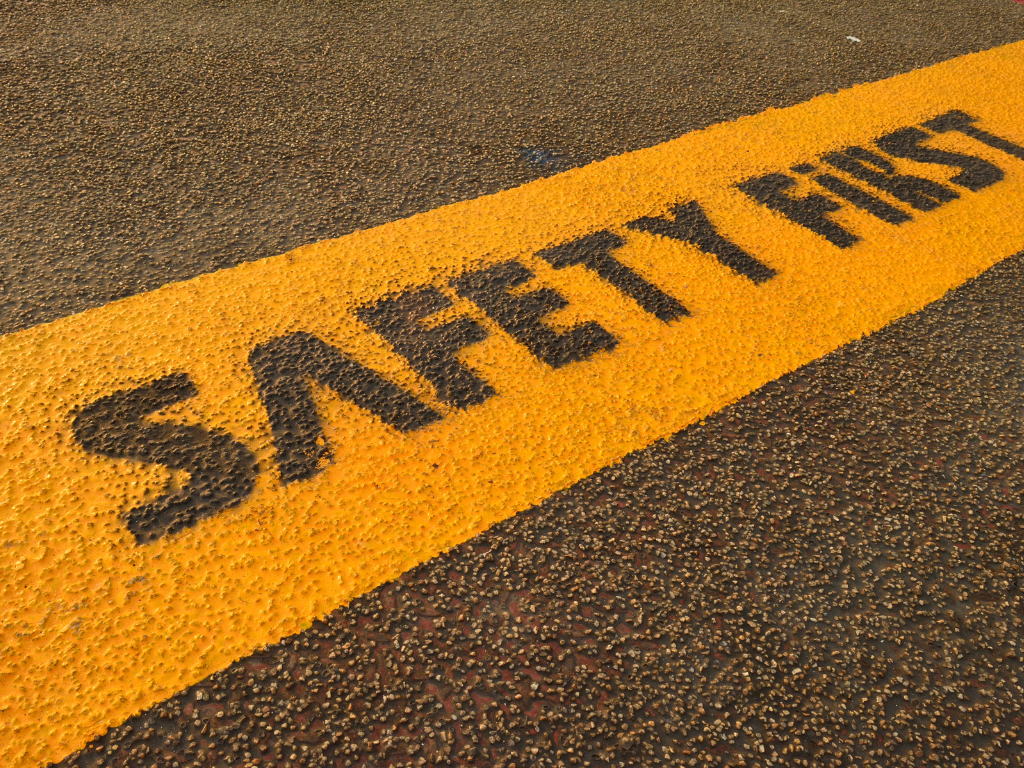 safety first sign painted on ground